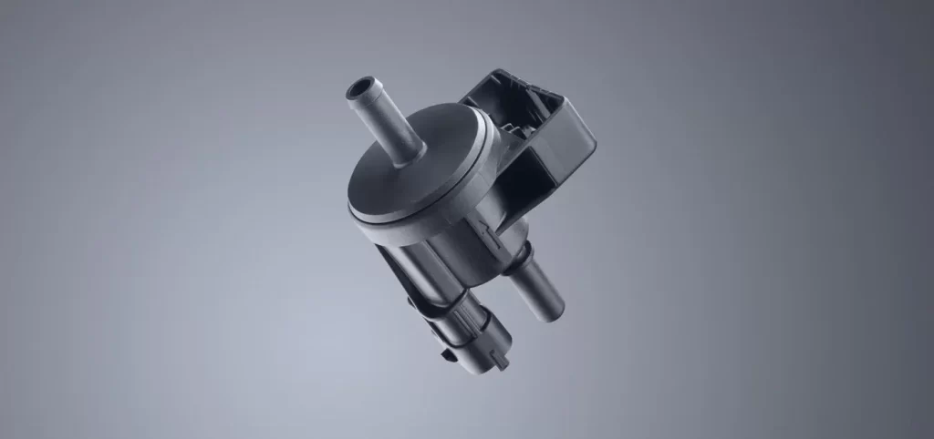 Precision metal fabrication of a custom machined metal component with detailed geometric features.