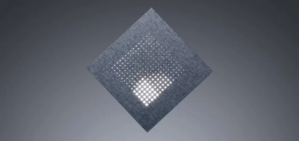 Perforated metal sheet created through precision sheet metal fabrication.